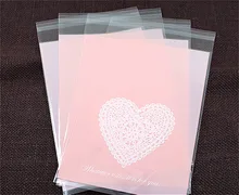 100 unids/lote bolsas de embalaje de galletas de plástico de corazones rosados envoltorio de cupcakes bolsas autoadhesivas 13x19 cm envío gratis(China)