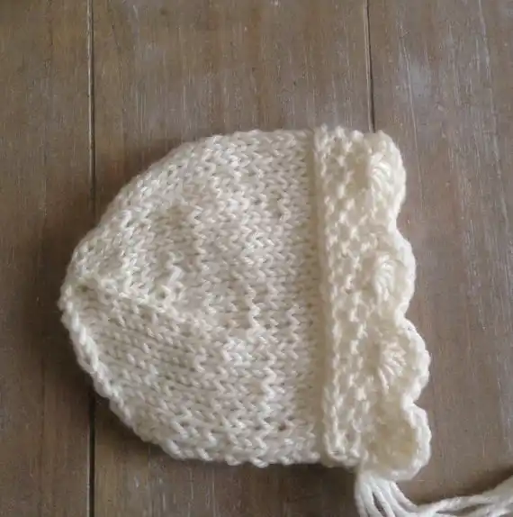 white knitted baby bonnet