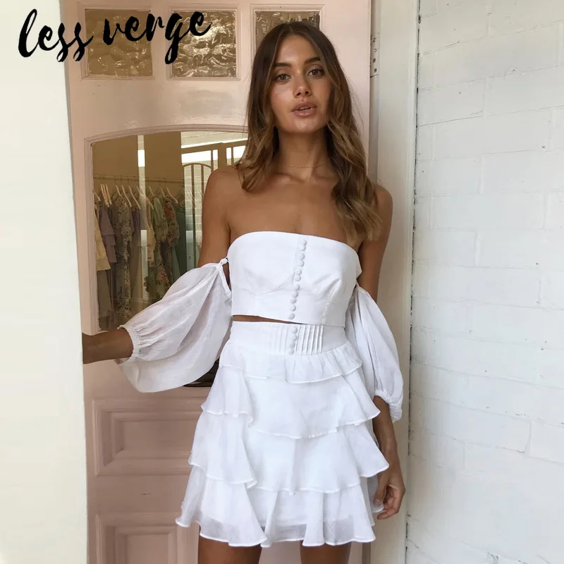 lessverge White cotton women blouses tops Short puff sleeve button front summer blouse shirts Sexy off shoulder pleated crop top
lessverge White cotton women blouses tops Short puff sleeve button front summer blouse shirts Sexy off shoulder pleated crop top