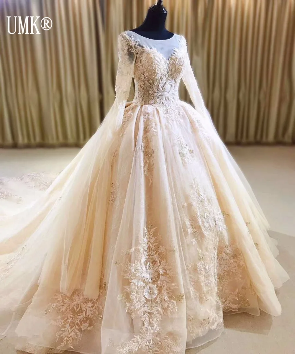 UMK New Design Champagne Muslim Wedding Dress Lace Vintage Long Sleeve Vestido De Noiva Luxury Ball Gown Wedding Dresses
UMK New Design Champagne Muslim Wedding Dress Lace Vintage Long Sleeve Vestido De Noiva Luxury Ball Gown Wedding Dresses
