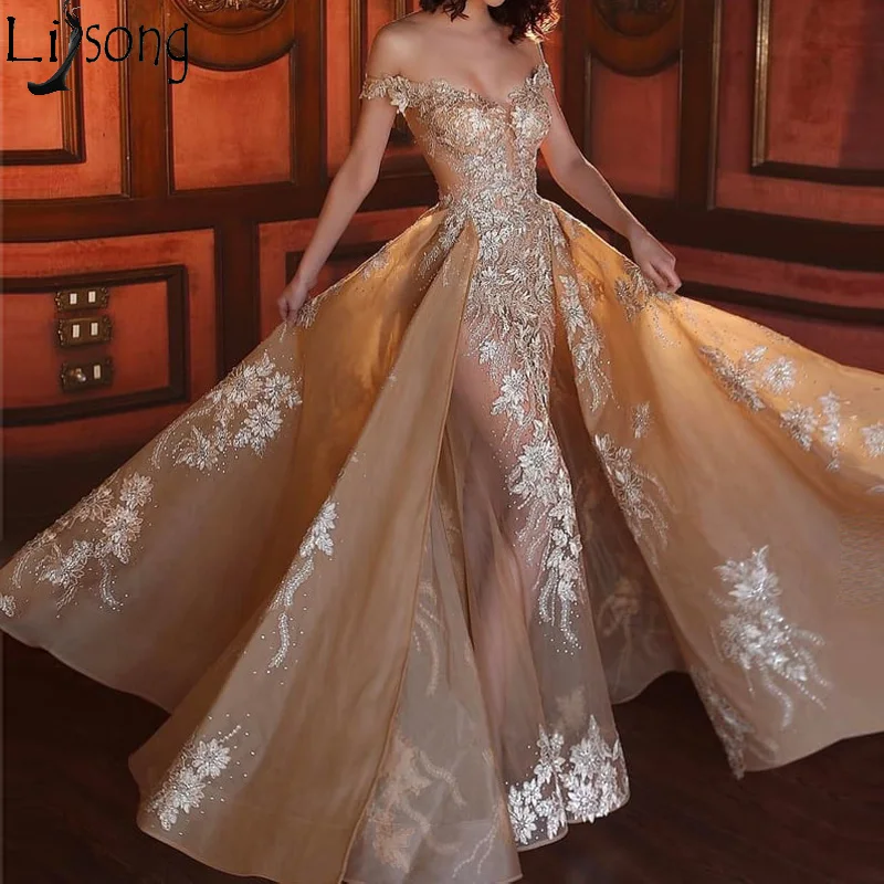 Unique Champagne Lace Mermaid Evening Gowns Detachable Train Sexy See Tru Long Bridal Dresses Floral Prom Gowns 2019
Unique Champagne Lace Mermaid Evening Gowns Detachable Train Sexy See Tru Long Bridal Dresses Floral Prom Gowns 2019