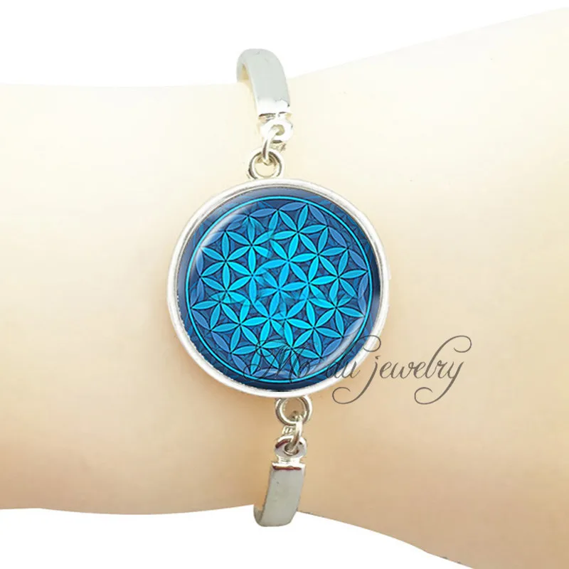 Blue flower of life charm bracelet spiritual mandala bracelet sacred geometry silver bracelet for women glass dome jewelry
Blue flower of life charm bracelet spiritual mandala bracelet sacred geometry silver bracelet for women glass dome jewelry