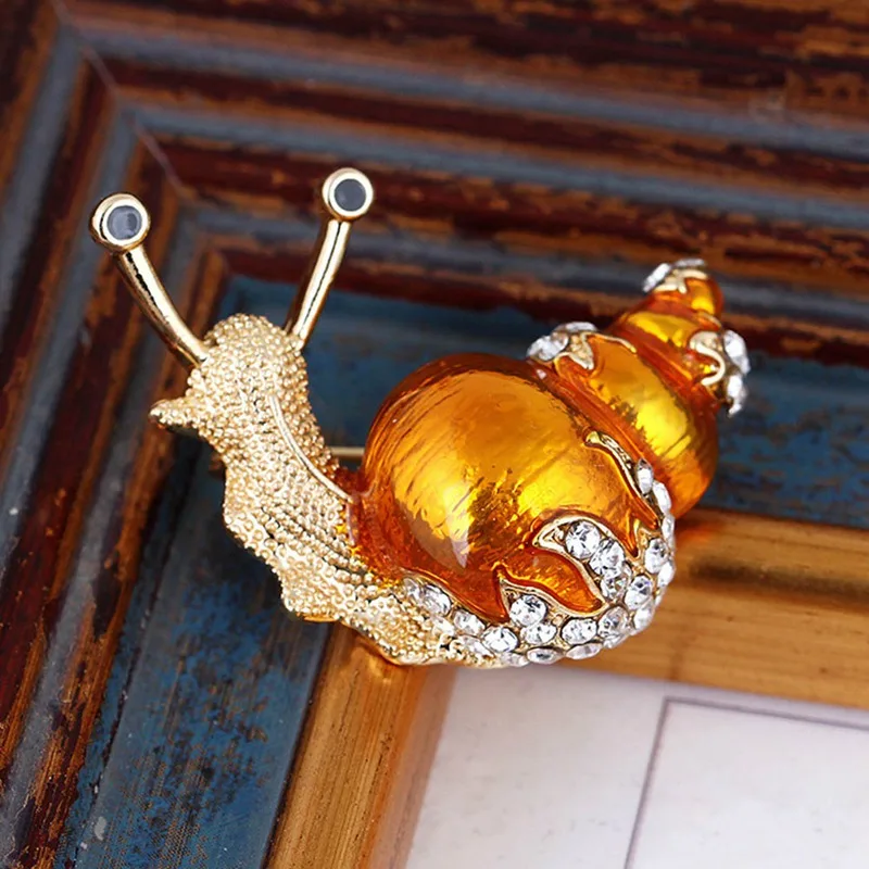 Korean Snail Cute Brooch Alloy Rhinestone Corsage Enamel Orange Snails Brooches Austrian Crystal Bijouterie Cute Snails Brooch
Korean Snail Cute Brooch Alloy Rhinestone Corsage Enamel Orange Snails Brooches Austrian Crystal Bijouterie Cute Snails Brooch