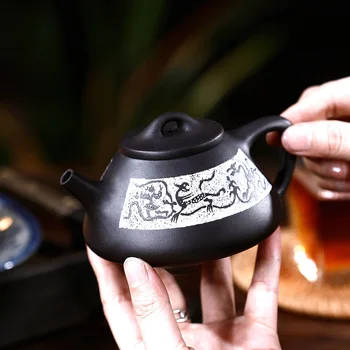 Yixing Dark-red Enameled Pottery Teapot Famous Manual Raw Ore Black Mud You Stone Pot Kungfu Online Teapot Tea Set
Yixing Dark-red Enameled Pottery Teapot Famous Manual Raw Ore Black Mud You Stone Pot Kungfu Online Teapot Tea Set