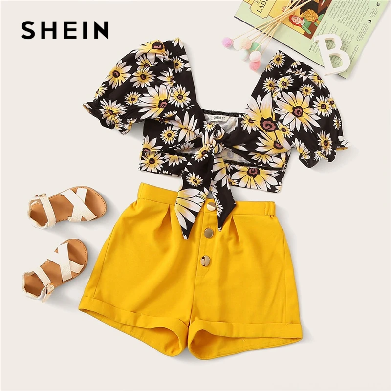 SHEIN Kiddie Girls V Neck Knot Cut Out Front Blouse And Rolled Hem Shorts Boho Set 2019 Summer Puff Sleeve Kids Two Piece Sets
SHEIN Kiddie Girls V Neck Knot Cut Out Front Blouse And Rolled Hem Shorts Boho Set 2019 Summer Puff Sleeve Kids Two Piece Sets