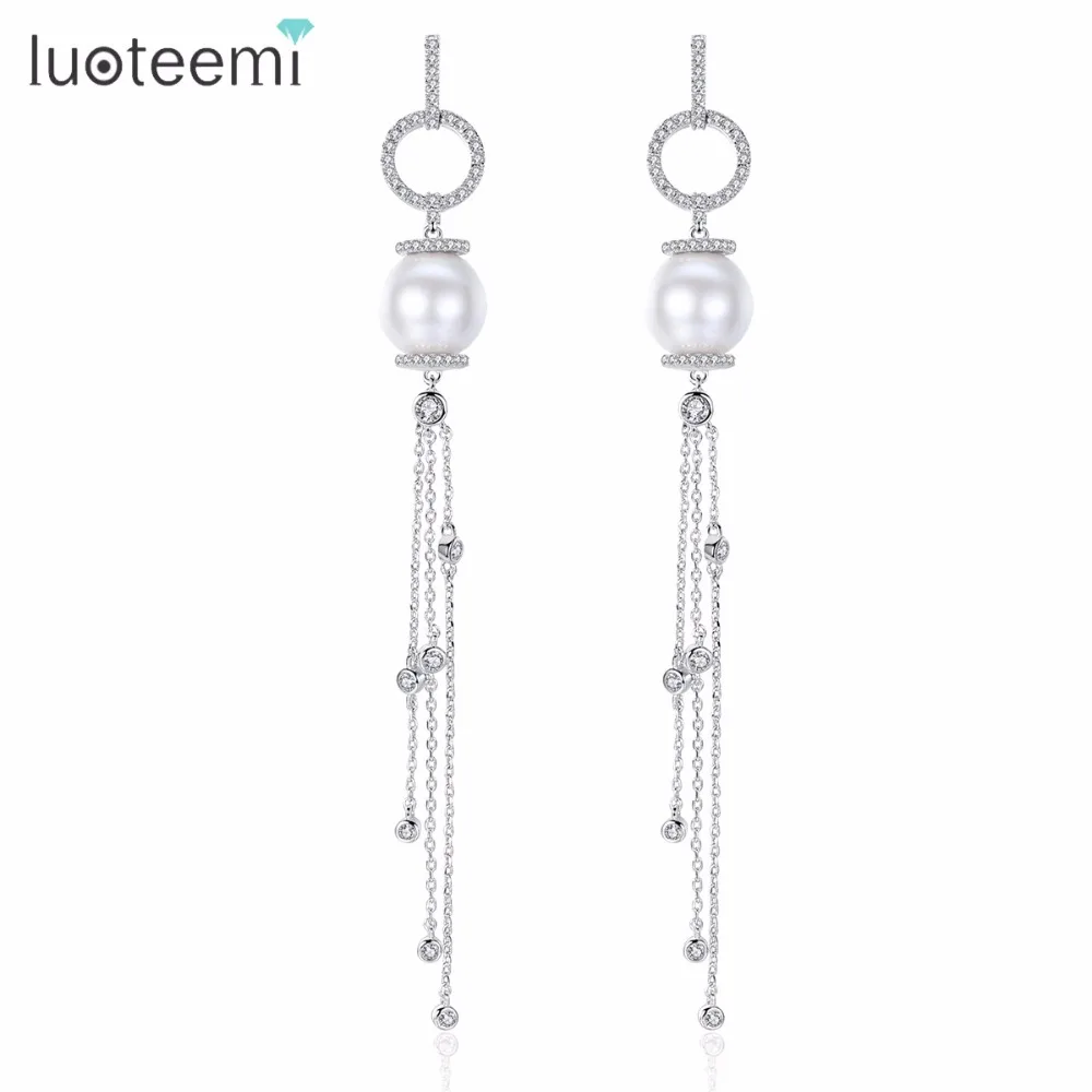 LUOTEEMI Cubic Zircon Paved Circle with White Imitation Pearl Drop Multiple Chain Tassel Long Dangle Earring for Women Wedding
LUOTEEMI Cubic Zircon Paved Circle with White Imitation Pearl Drop Multiple Chain Tassel Long Dangle Earring for Women Wedding