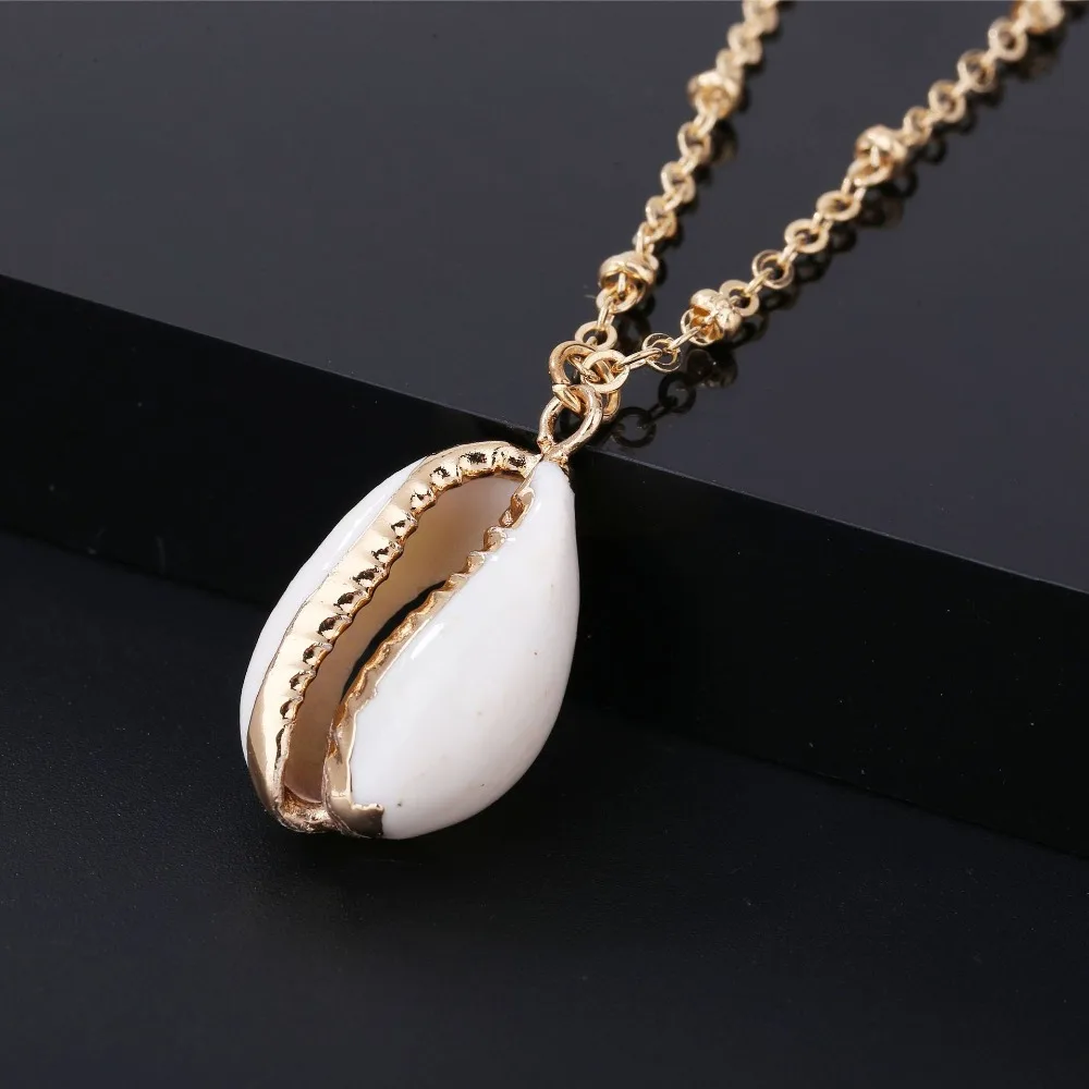Summer Natural Shell Wrapped Gold Necklace for Women Natural Cowrie Shell Pendant With Double Bails Gold Trim Chain Necklace
Summer Natural Shell Wrapped Gold Necklace for Women Natural Cowrie Shell Pendant With Double Bails Gold Trim Chain Necklace