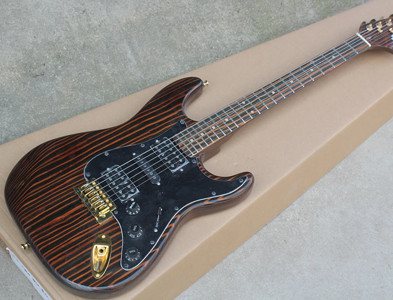 Factory custom milk zebra wood electric guitar with HSH pickguard,Black pickguard,Gold hardwares
Factory custom milk zebra wood electric guitar with HSH pickguard,Black pickguard,Gold hardwares