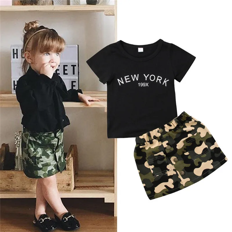 2pcs Summer Baby Girls Clothing Set Black Letter T-shir t+ Camouflage Skirts with Pockets Buttom Outfits For Newborn Toddler
2pcs Summer Baby Girls Clothing Set Black Letter T-shir t+ Camouflage Skirts with Pockets Buttom Outfits For Newborn Toddler