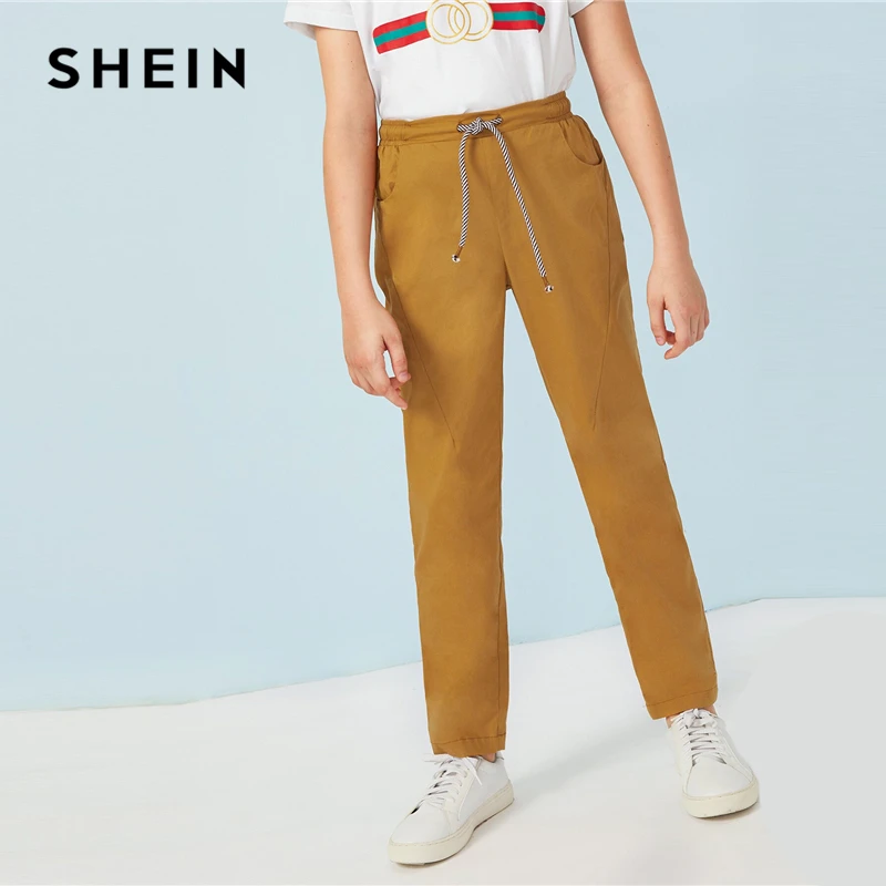 SHEIN Kiddie Toddler Boys Ginger Solid Drawstring Waist Casual Pants Children Bottoms 2019 Summer Pocket Straight Leg Trousers
SHEIN Kiddie Toddler Boys Ginger Solid Drawstring Waist Casual Pants Children Bottoms 2019 Summer Pocket Straight Leg Trousers
