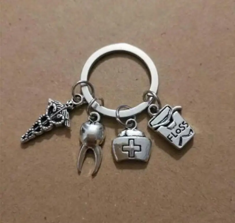 1pcs Dental Dentist Keychain Nurse Cap Tooth/Floss Keychain For Keys Car Bag Charm Key Ring Handbag Couple Key Chains Jewelry
1pcs Dental Dentist Keychain Nurse Cap Tooth/Floss Keychain For Keys Car Bag Charm Key Ring Handbag Couple Key Chains Jewelry