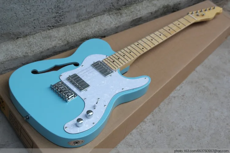 Wholesale Factory custom blue semi-hollow electric guitar with maple fingerboard,white pearl pickguard,can be customized
Wholesale Factory custom blue semi-hollow electric guitar with maple fingerboard,white pearl pickguard,can be customized