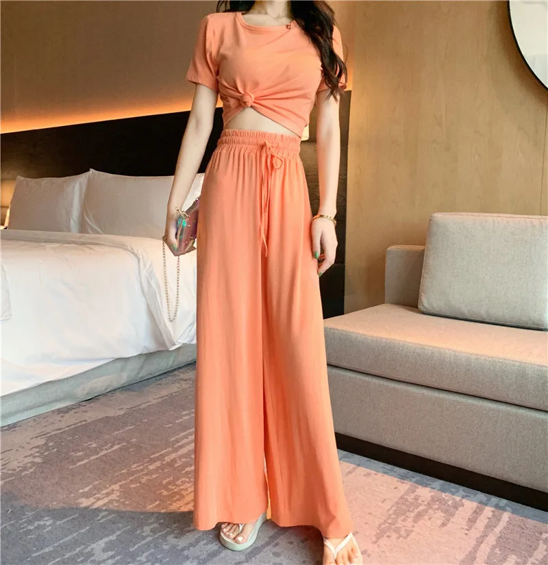 Plus Size 2 Two Piece Set Club Outfits Casual Slim Fit Orange Tracksuit Women Matching Sets Short Sleeve Top and Wide Leg Pants
Plus Size 2 Two Piece Set Club Outfits Casual Slim Fit Orange Tracksuit Women Matching Sets Short Sleeve Top and Wide Leg Pants