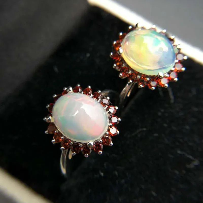 Tbj,Natural ethiopian Opal oval cut8*10 mm gemstone ring with natural garnet side stones in 925 sterling silver with gift box
Tbj,Natural ethiopian Opal oval cut8*10 mm gemstone ring with natural garnet side stones in 925 sterling silver with gift box
