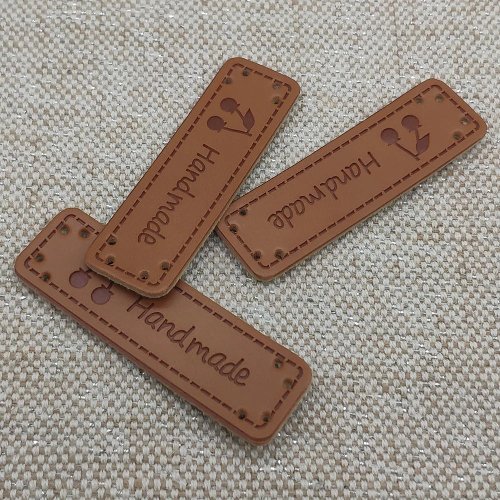 Cherry logo hand made brown leather tags Natural style sewing labels for children clothes free style leather decorative label
Cherry logo hand made brown leather tags Natural style sewing labels for children clothes free style leather decorative label