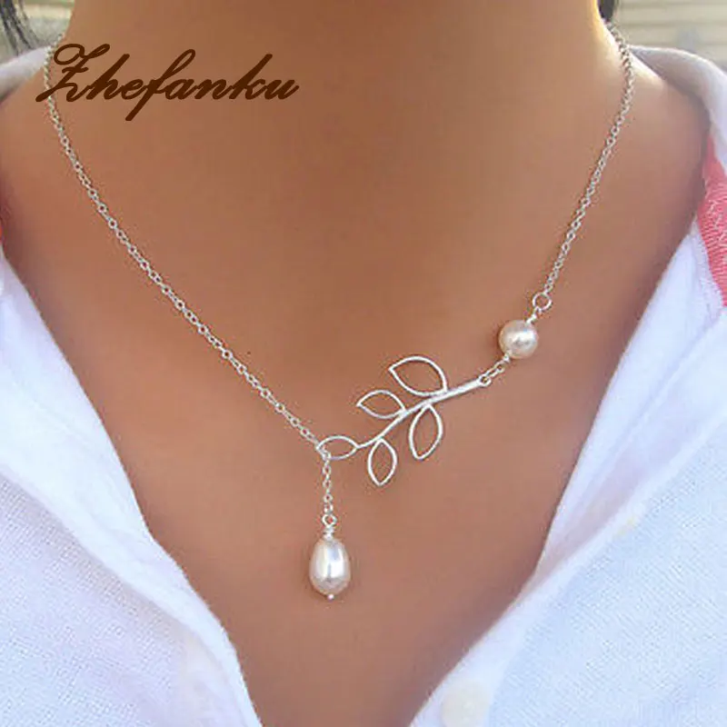 High Quality Hollow Leaves Shaped Simulated Pearl Woman Necklace With Clavicle Chain Silver Plated Charming Jewelery NL-0689
High Quality Hollow Leaves Shaped Simulated Pearl Woman Necklace With Clavicle Chain Silver Plated Charming Jewelery NL-0689