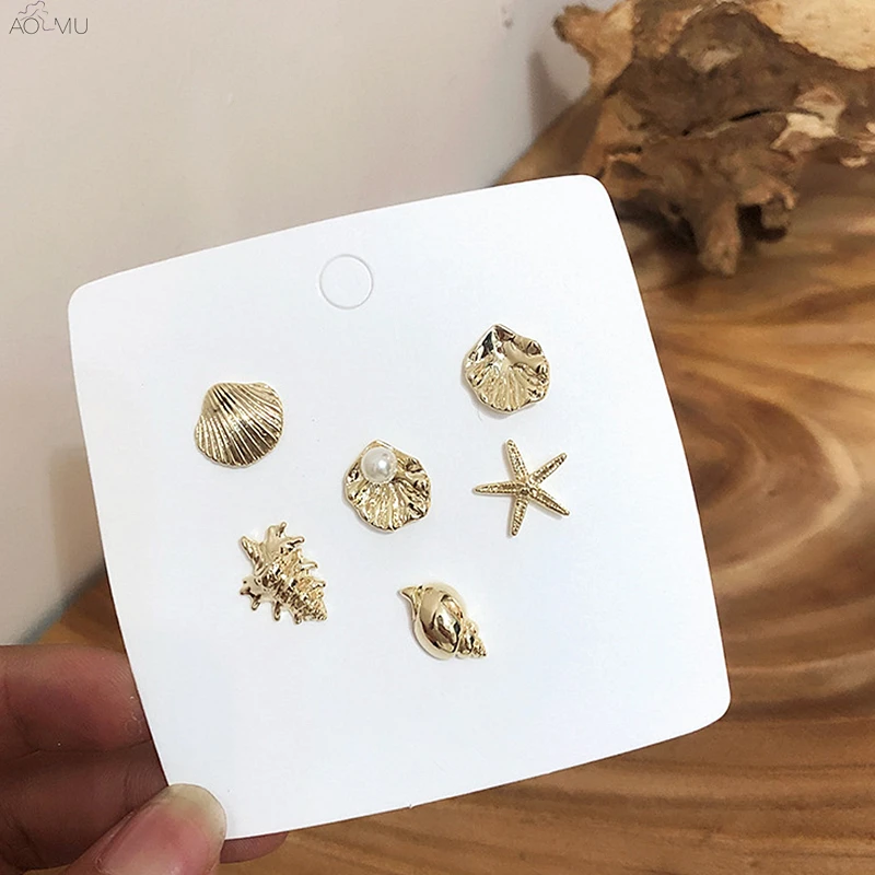 AOMU 2019 Fashion Metal Gold Irregular Conch Shell Starfish Geometric Pearl Stud Earrings Set for Women Girl Party Beach Jewelry
AOMU 2019 Fashion Metal Gold Irregular Conch Shell Starfish Geometric Pearl Stud Earrings Set for Women Girl Party Beach Jewelry