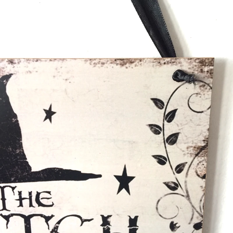 Fly away to the dark side of Halloween décor with this enchanting "The Witch Is In" rustic wooden plaque! This quirky decoration is sure to spark conversations and cast a spell over trick-or-treaters. Come, come! The Witch Is In!  On the back side it says "Out of Candy".