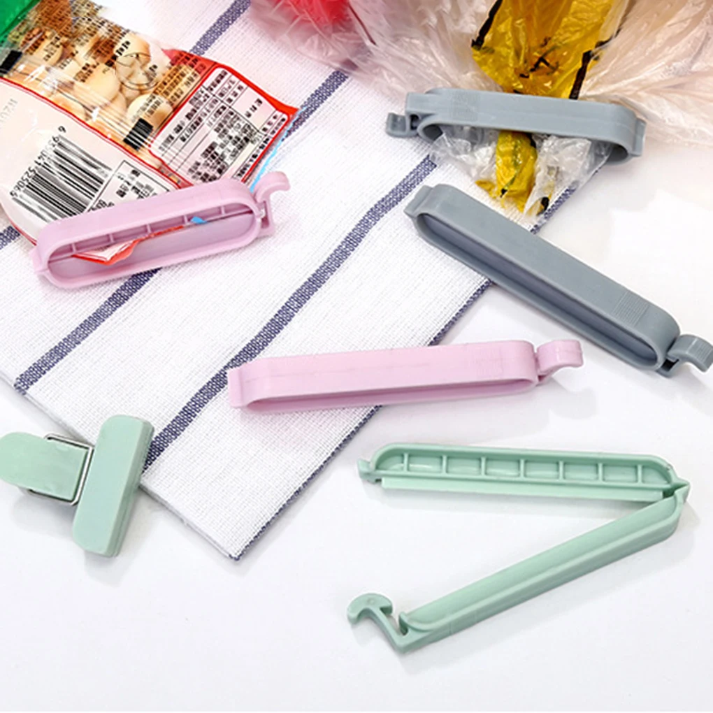 New 12pcs Plastic Sealing Clips Clamp Snack Fresh Food Storage Bag Sealer Household Kitchen Tools
New 12pcs Plastic Sealing Clips Clamp Snack Fresh Food Storage Bag Sealer Household Kitchen Tools