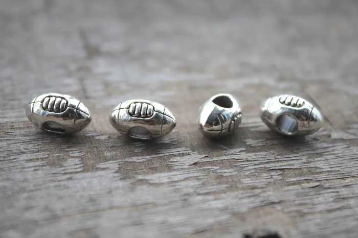 12PCS, Football Bead Charm, Rugby, Sports Slider Large Hole Bead, European Bead, Jewelry Making Supplies, 14*9*7MM, Hole 4.7MM
12PCS, Football Bead Charm, Rugby, Sports Slider Large Hole Bead, European Bead, Jewelry Making Supplies, 14*9*7MM, Hole 4.7MM
