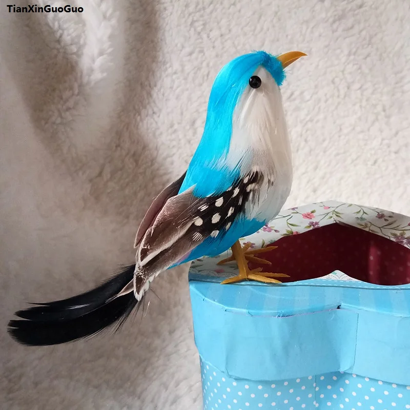 about 12cm simulation bird hard model coloured blue feathers bird prop,home garden decoration gift s1168
about 12cm simulation bird hard model coloured blue feathers bird prop,home garden decoration gift s1168