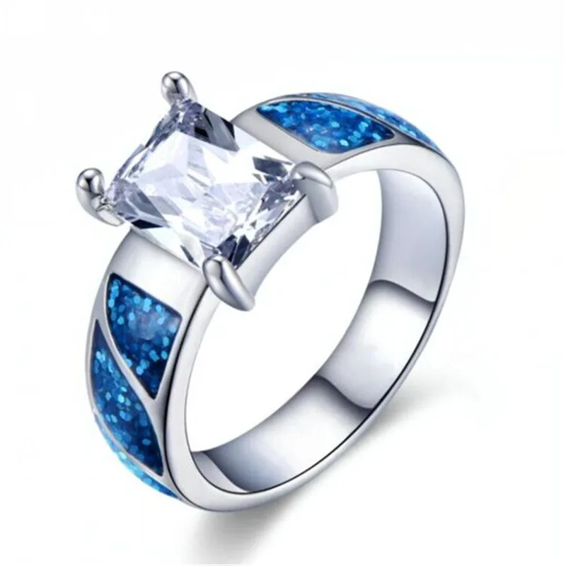 CHENGEN New Blue opal Noble white square lady's ring Elegant woman Wedding party gifts
CHENGEN New Blue opal Noble white square lady's ring Elegant woman Wedding party gifts