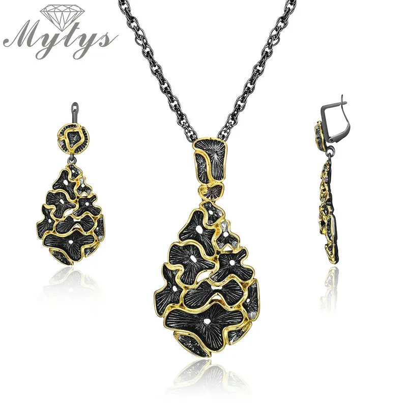 Mytys Vintage Black Gun Jewelry Sets Yellow Gold Lace Flower Design Fashion Women Antique Statement Earrings Necklace Sets CN512
Mytys Vintage Black Gun Jewelry Sets Yellow Gold Lace Flower Design Fashion Women Antique Statement Earrings Necklace Sets CN512