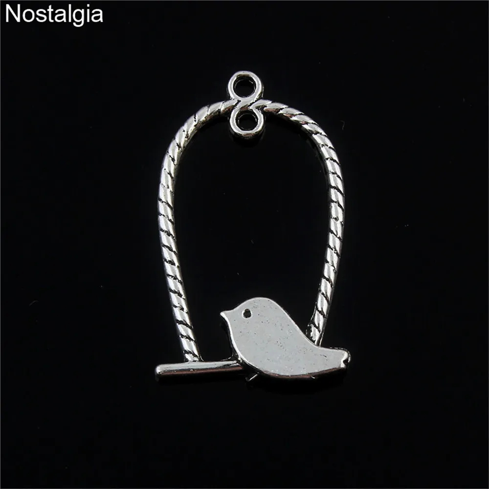 Nostalgia 20Pcs Cute Bird Standing In Cage Necklace Charms Pendants Jewelry Making 30*15MM 
Nostalgia 20Pcs Cute Bird Standing In Cage Necklace Charms Pendants Jewelry Making 30*15MM