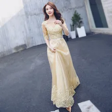 Женское длинное платье золотистого цвета элегантное для