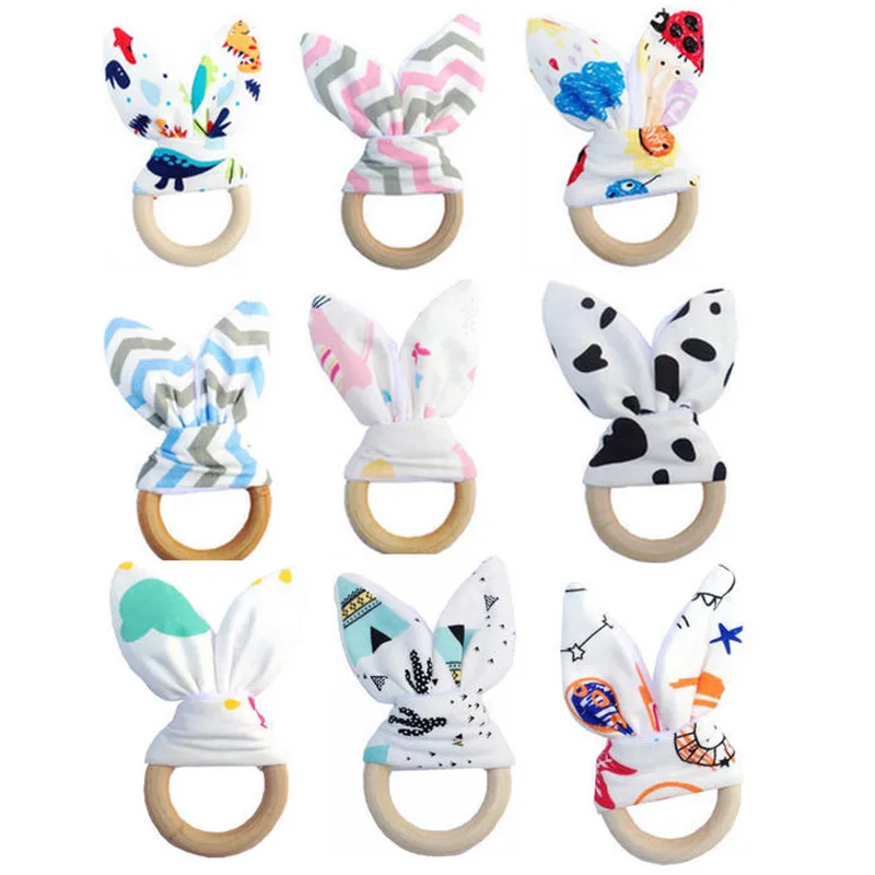 Bunny Ear Wooden Ring Teether Bell Natural Wood Teether Circle Fabric Wooden Teething Training Baby Teether Jewelry Teething
Bunny Ear Wooden Ring Teether Bell Natural Wood Teether Circle Fabric Wooden Teething Training Baby Teether Jewelry Teething