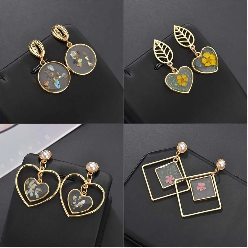 Girls Earrings Transparent Resin Dried Flower Earrings Simple Geometric Pendant Gold Earrings Shell Pearl Fashion Jewelry
Girls Earrings Transparent Resin Dried Flower Earrings Simple Geometric Pendant Gold Earrings Shell Pearl Fashion Jewelry