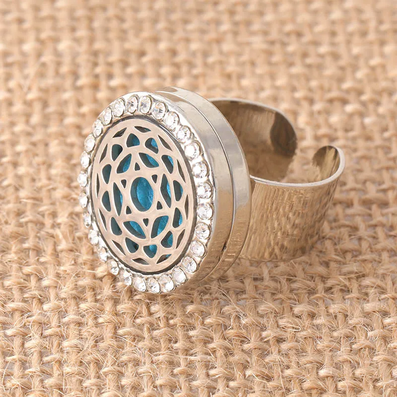 Sun flower pattern crystal stainless steel adjustable aroma box ring suitable for men and women fashion jewelr+1 felt mat SCH718
Sun flower pattern crystal stainless steel adjustable aroma box ring suitable for men and women fashion jewelr+1 felt mat SCH718