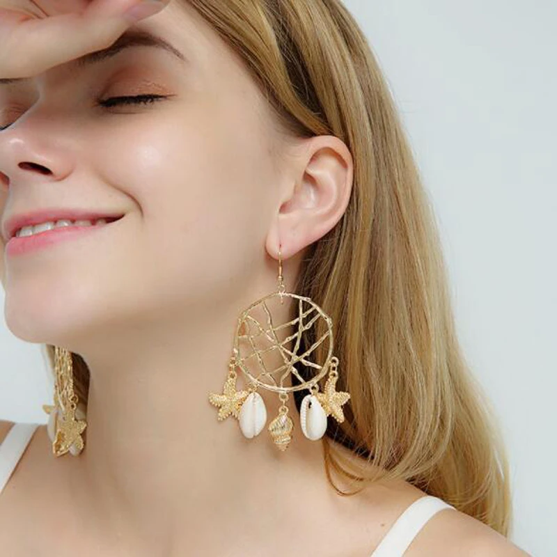 Docona New Arrival Tendy Dream Gold Color Drop Earrings Hollow Geometric Shell Exquisite Star Jewelry For Women Ladies Gift
Docona New Arrival Tendy Dream Gold Color Drop Earrings Hollow Geometric Shell Exquisite Star Jewelry For Women Ladies Gift