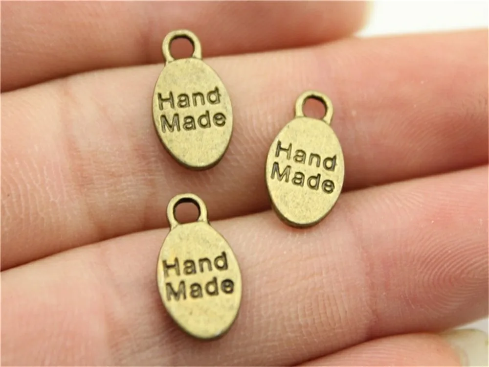 WYSIWYG 20pcs 15x8mm Double Sided Hand Made Charms For Jewelry Making Antique Bronze Color Hand Made Charms Charm Hand Made Tag
WYSIWYG 20pcs 15x8mm Double Sided Hand Made Charms For Jewelry Making Antique Bronze Color Hand Made Charms Charm Hand Made Tag