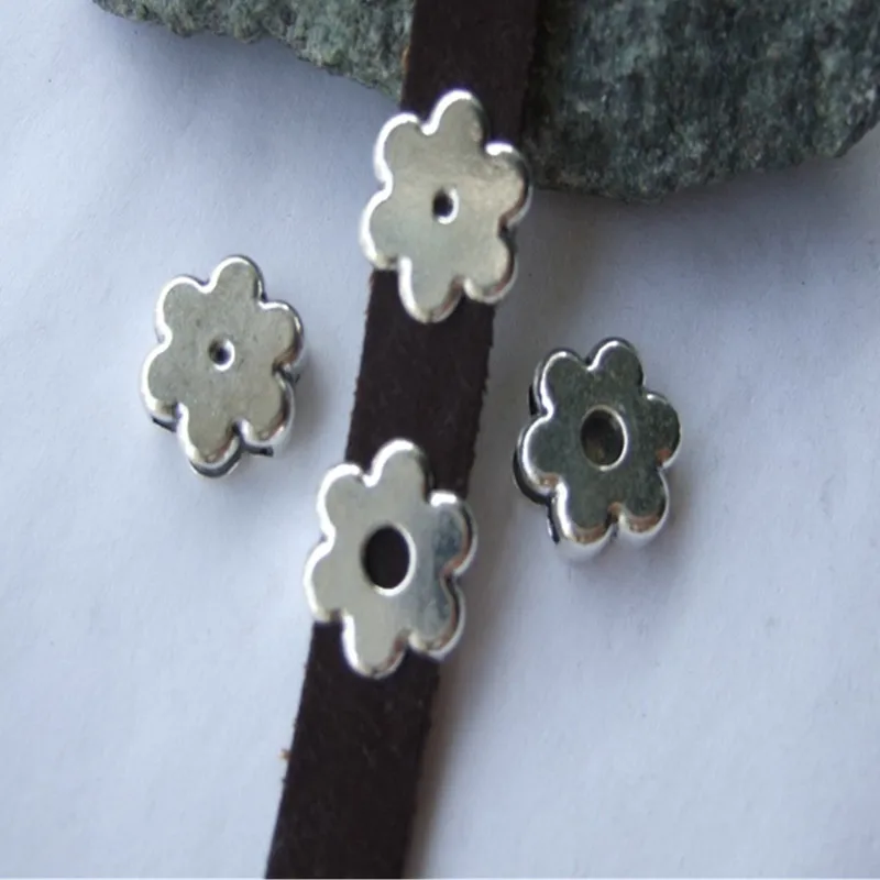 

10 pcs Antique Silver Sun Flower Shaped Zinc Alloy Slider Spacers For 10*2mm Flat Leather Cord Jewelry Fittings