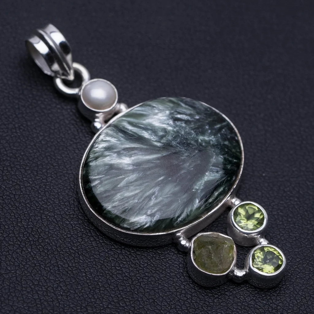 Natural Seraphinite,River Pearl,Rough Moldavite&Peridot 925 Sterling Silver Pendant 2 1/4" P0124
Natural Seraphinite,River Pearl,Rough Moldavite&Peridot 925 Sterling Silver Pendant 2 1/4" P0124