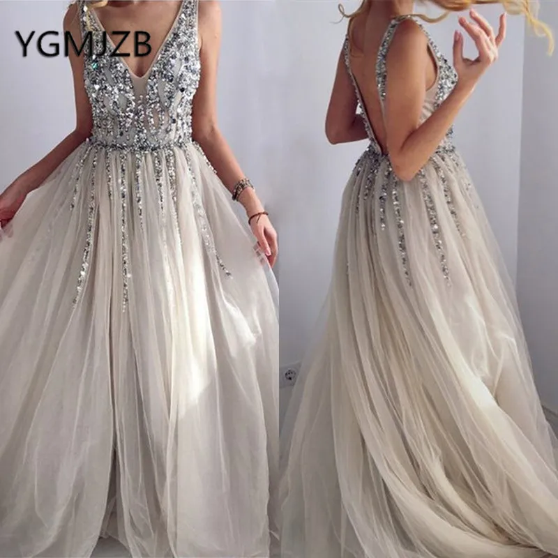 Backless Evening Dresses Long 2019 A-Line V-Neck Sparkly Beaded Crystal Tulle Saudi Arabic Women Formal Prom Gown Party Dress
Backless Evening Dresses Long 2019 A-Line V-Neck Sparkly Beaded Crystal Tulle Saudi Arabic Women Formal Prom Gown Party Dress