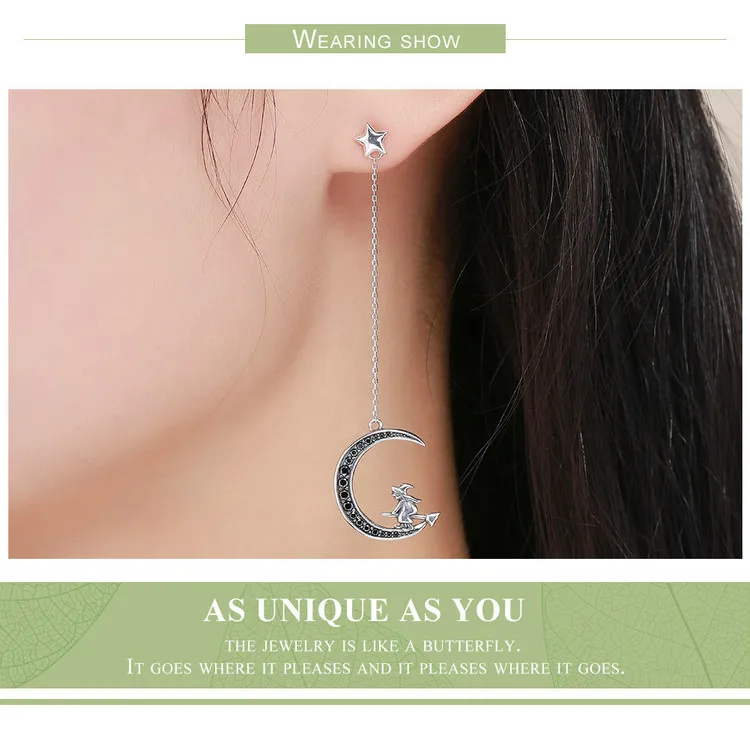 Moon Witch Dangle Earrings 13 Moon Witch Dangle Earrings - Inspired by the magic witch in the fairy tales, the ornament is very cute and delicate. The Moon Witch Dangle Earrings feature ear buckets in the shape of stars with long chains that link to exquisite crescent moon elements with little witches on them. The long earrings design modifies the contour of the face. Perfect gift for Halloween and witch lovers. | 🚚 Free Standard Shipping 7-30 days | 🥇 Top Quality Product | 💎 100% S925 Sterling Silver | 🛡️ 100% Safe & Secure checkout