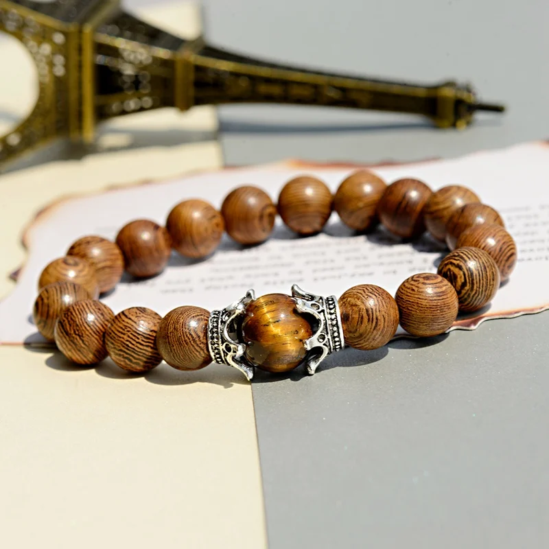 OIQUEI Thailand 10mm Wood Beads Men's Bracelet Sliver Double Crown 12mm Tiger Eye Stone Bracelet Men Jewelry pulsera masculina
OIQUEI Thailand 10mm Wood Beads Men's Bracelet Sliver Double Crown 12mm Tiger Eye Stone Bracelet Men Jewelry pulsera masculina