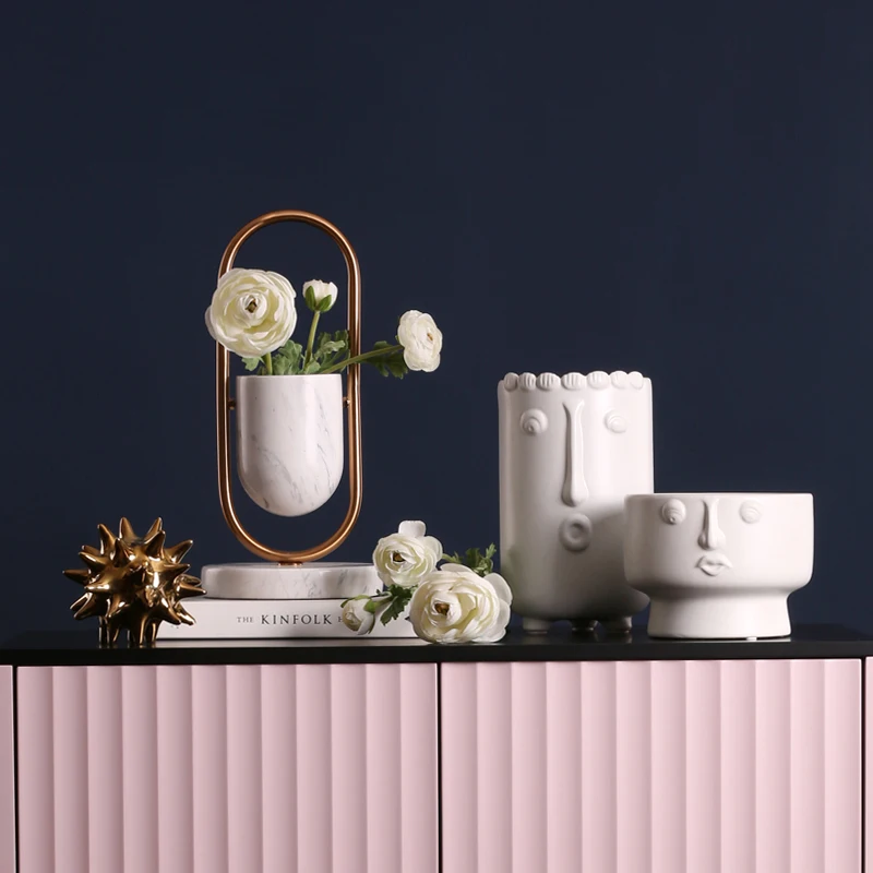 Nordic minimalist ceramic abstract vase white face creative showroom decoration creative vase home decoration ornaments
Nordic minimalist ceramic abstract vase white face creative showroom decoration creative vase home decoration ornaments
