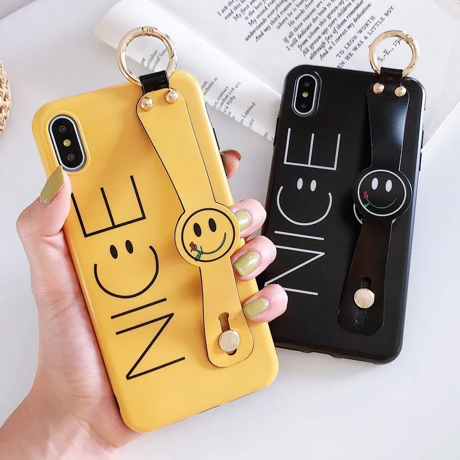 Nice Case for iPhone 7 8 6S 6 Plus Luxury Smile Wrist Strap Phone Stand Cover for iPhone XS Max XR X 7 Plus Case Coque Funda
Nice Case for iPhone 7 8 6S 6 Plus Luxury Smile Wrist Strap Phone Stand Cover for iPhone XS Max XR X 7 Plus Case Coque Funda