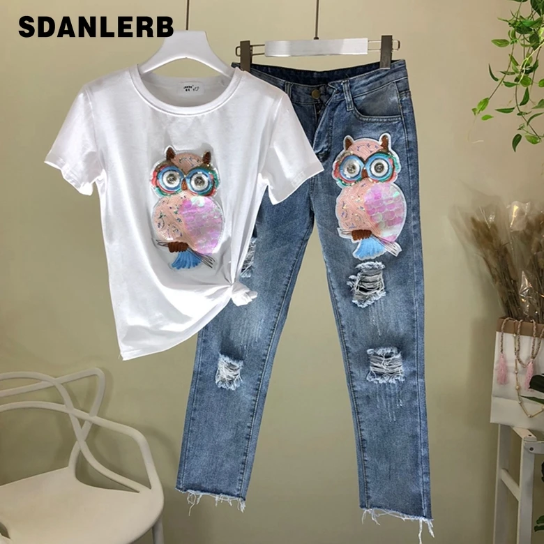 2019 Spring Summer New Sequins Owl Short-sleeved T-shirt + Broken Hole Eight-cent Jeans Suit Female Two Piece Sets Girl Students
2019 Spring Summer New Sequins Owl Short-sleeved T-shirt + Broken Hole Eight-cent Jeans Suit Female Two Piece Sets Girl Students