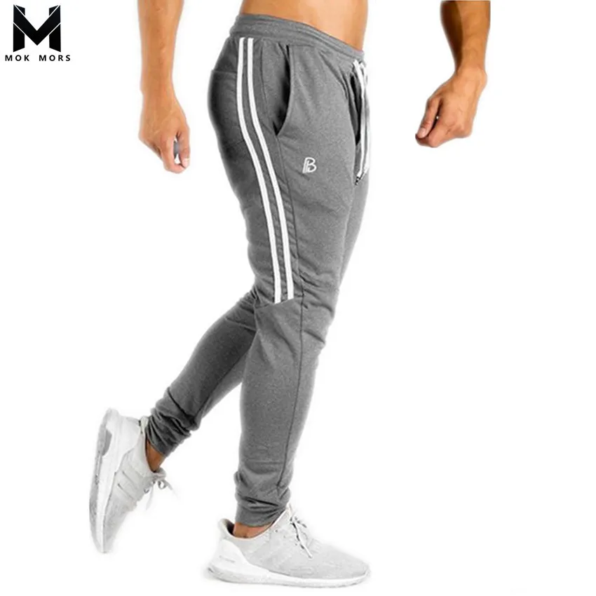 2018 New Mens Cotton Sweatpants Gyms Fitness Workout Slim Solid Trousers Men Casual Fashion Pencil Pants Joggers Sportswear
2018 New Mens Cotton Sweatpants Gyms Fitness Workout Slim Solid Trousers Men Casual Fashion Pencil Pants Joggers Sportswear
