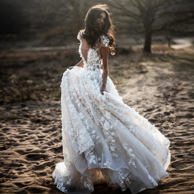 Stylish A Line Bohemian Wedding Dresses V Neck Cap Sleeve Bead 3D Flower Country Wedding Gown Tiered Boho Bridal Gowns
Stylish A Line Bohemian Wedding Dresses V Neck Cap Sleeve Bead 3D Flower Country Wedding Gown Tiered Boho Bridal Gowns