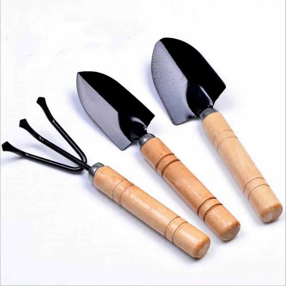 3 Piece Mini Garden Tool Set Gardening Shovels + Spade + Rale With Wooden Handles Metal Head Gardener Bonsai Tool Garden Tools
3 Piece Mini Garden Tool Set Gardening Shovels + Spade + Rale With Wooden Handles Metal Head Gardener Bonsai Tool Garden Tools