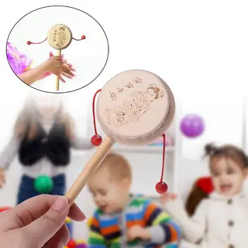 Wood Cartoon Chinese Traditional Spinning Rattle Drum Hand Bell Baby Musical Toy
Wood Cartoon Chinese Traditional Spinning Rattle Drum Hand Bell Baby Musical Toy