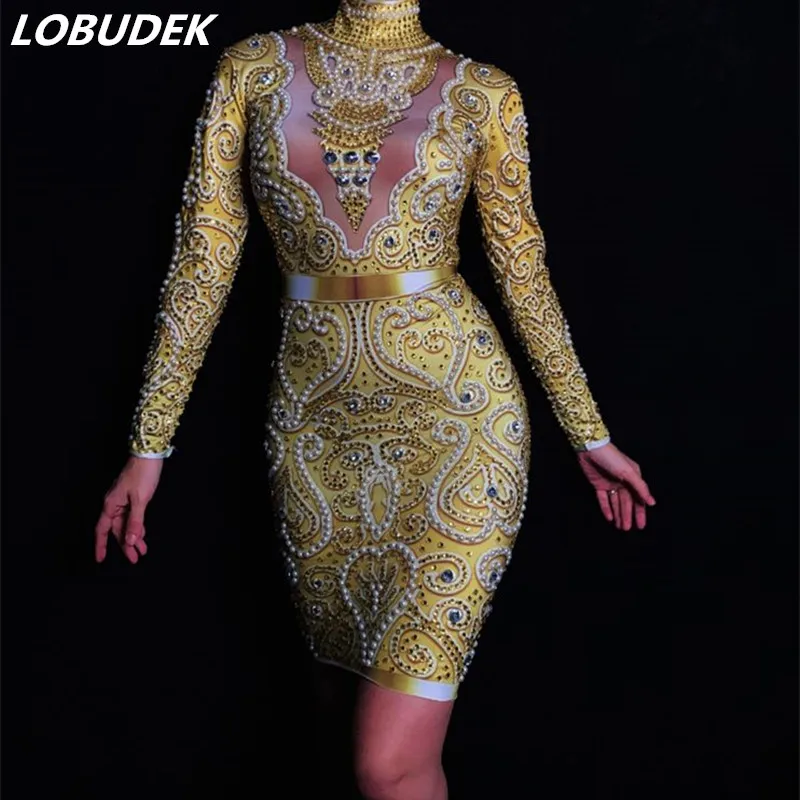 High Quality Women Gold Rhinestones Pearls Dress Sexy Long Sleeve Skinny Short Dress Prom Party Singer Costume DS Stage Outfit
High Quality Women Gold Rhinestones Pearls Dress Sexy Long Sleeve Skinny Short Dress Prom Party Singer Costume DS Stage Outfit