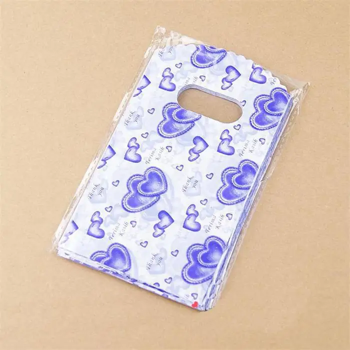 100pcs/Lot 14X9CM Plastic Packaging Bags With Handle Small Gift Bags Home Storage
100pcs/Lot 14X9CM Plastic Packaging Bags With Handle Small Gift Bags Home Storage