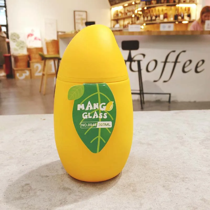 Creative Mango Shape Glass Water Bottle With Silicone Belt Leakproof Glass Drink Spacecup Potable Glass Sports Kettle 300ml SH36
Creative Mango Shape Glass Water Bottle With Silicone Belt Leakproof Glass Drink Spacecup Potable Glass Sports Kettle 300ml SH36