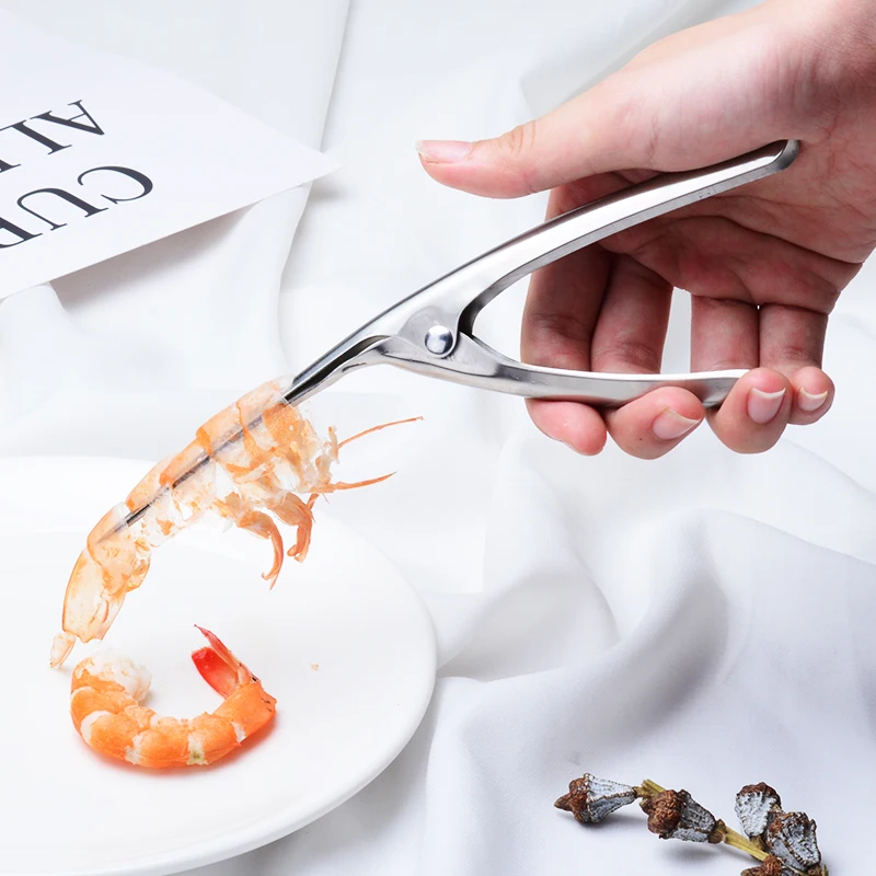 Shrimp Peeler 304 Stainlesss Prawn Peeler Shrimp Deveiner Peel Device Fishing Knife Creative Kitchen Gadget Cooking Seafood Tool
Shrimp Peeler 304 Stainlesss Prawn Peeler Shrimp Deveiner Peel Device Fishing Knife Creative Kitchen Gadget Cooking Seafood Tool